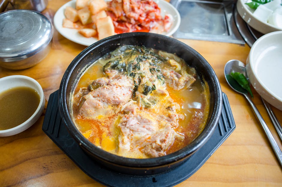 Bubbling kimchi jjigae Korean kimchi stew in earthenware pot