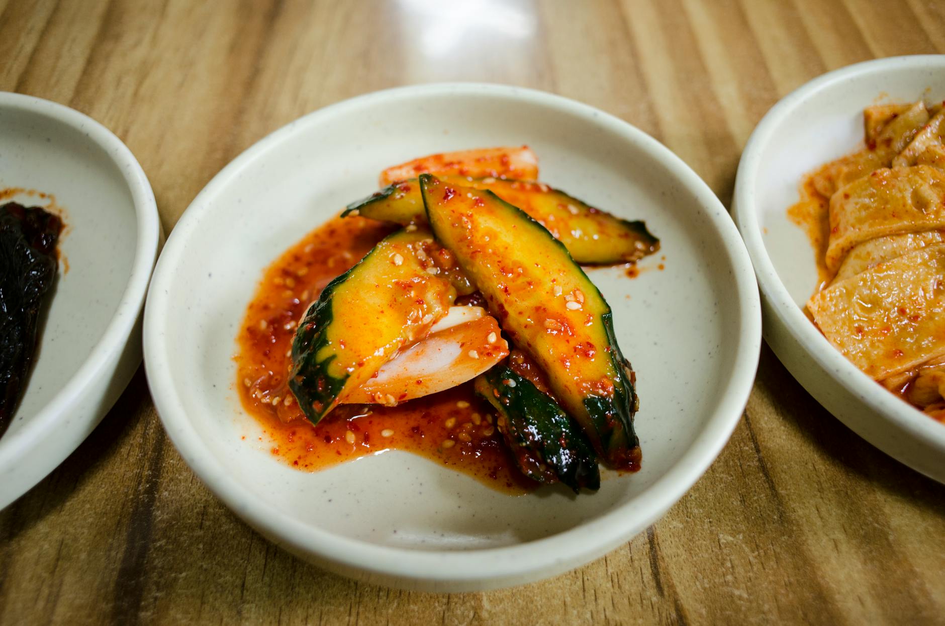 Colorful Korean banchan side dishes including kimchi at a BBQ restaurant