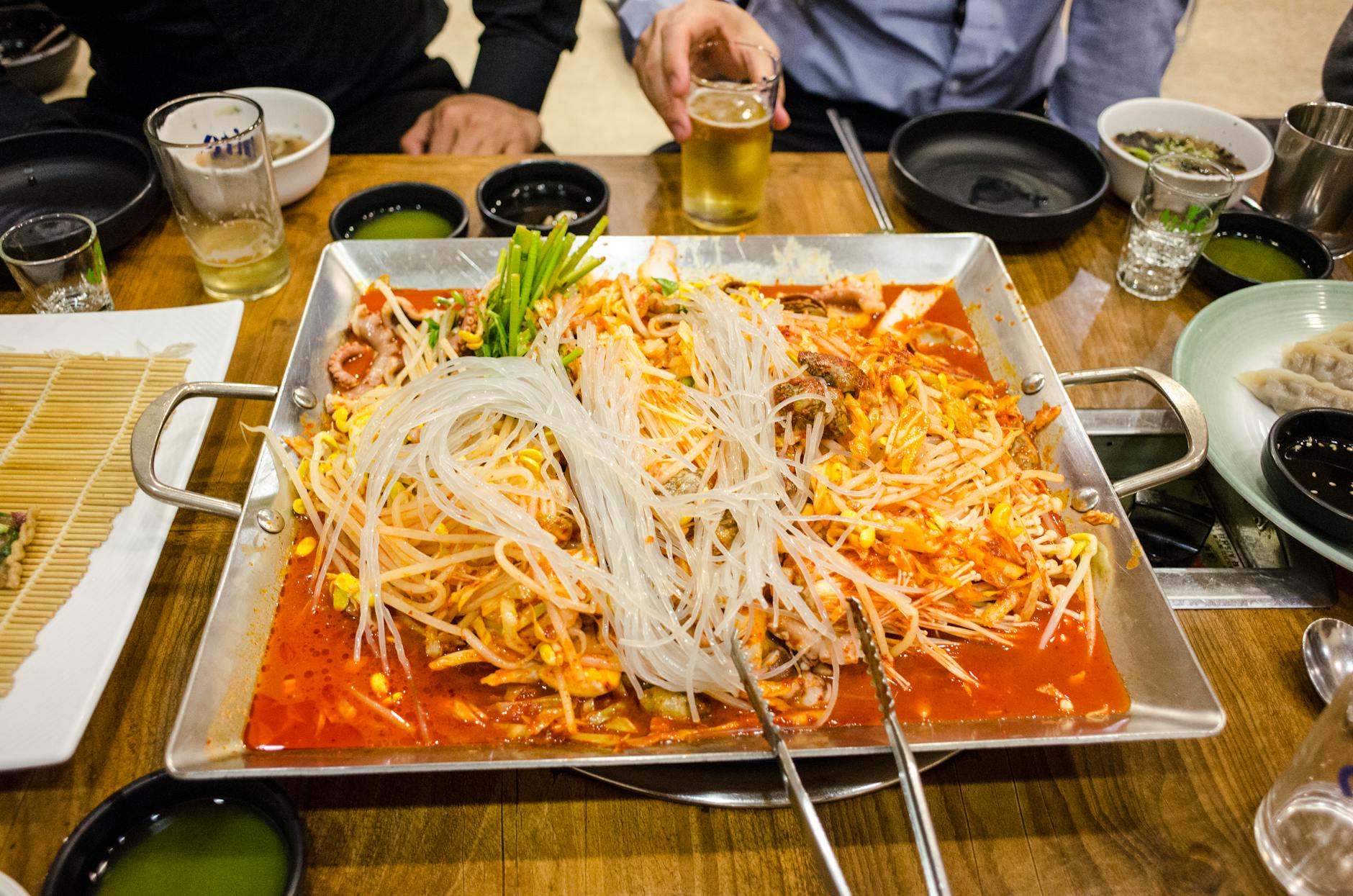 Korean food restaurant interior with grills and customers in Seoul