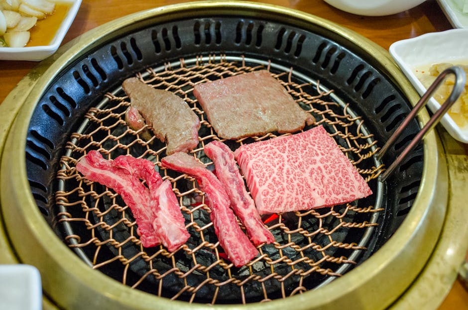 Samgyeopsal Korean BBQ pork belly grilling on a tabletop grill in Seoul