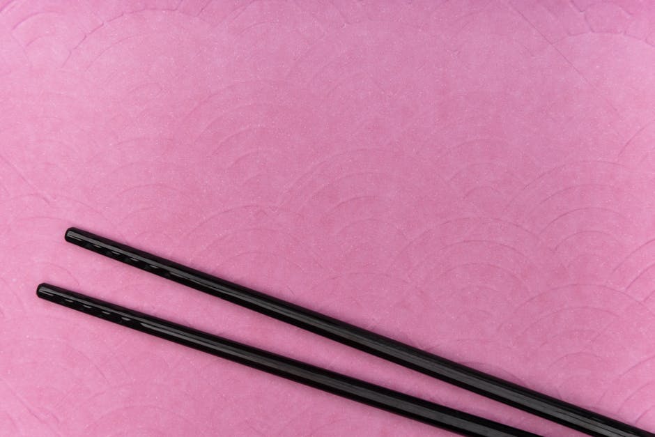 Korean metal chopsticks and spoon at a traditional table setting
