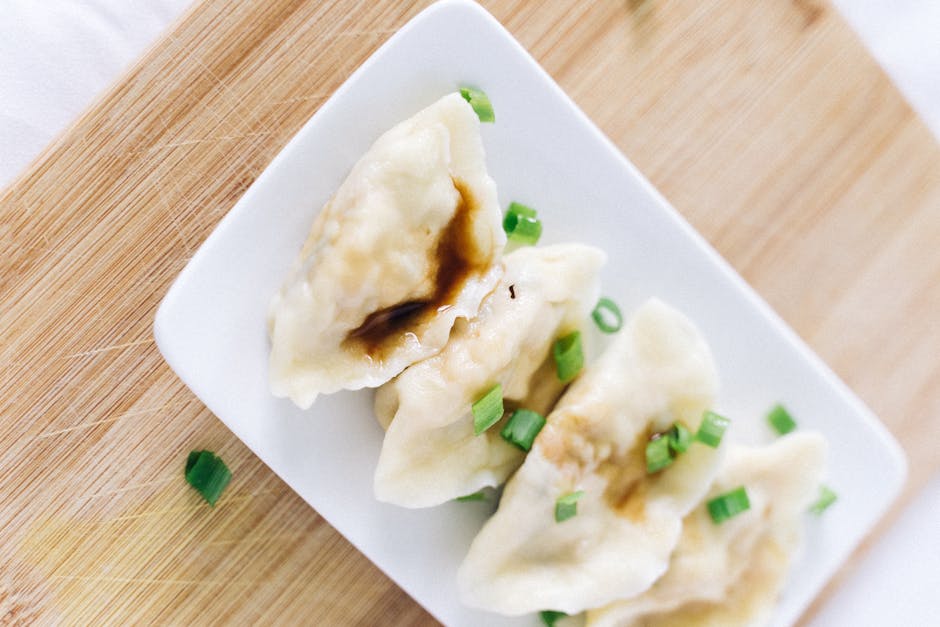 Steamed Korean mandu dumplings with dipping sauce