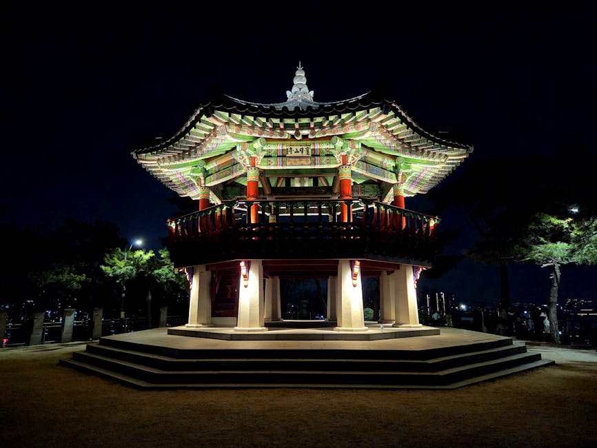 Beautifully lit traditional Korean pavilion at night in Seoul
