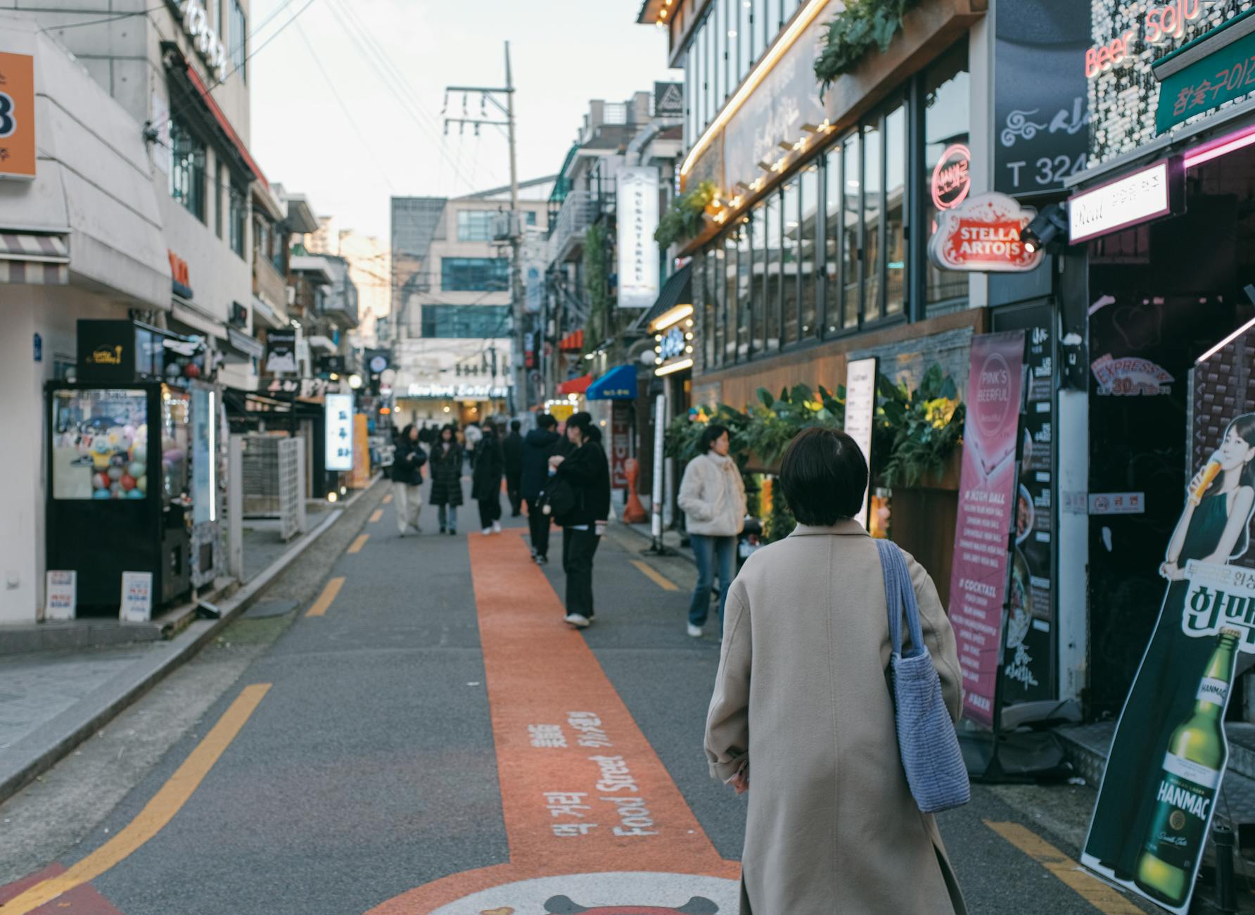 Crowded modern Seoul street with pedestrians and skyscrapers