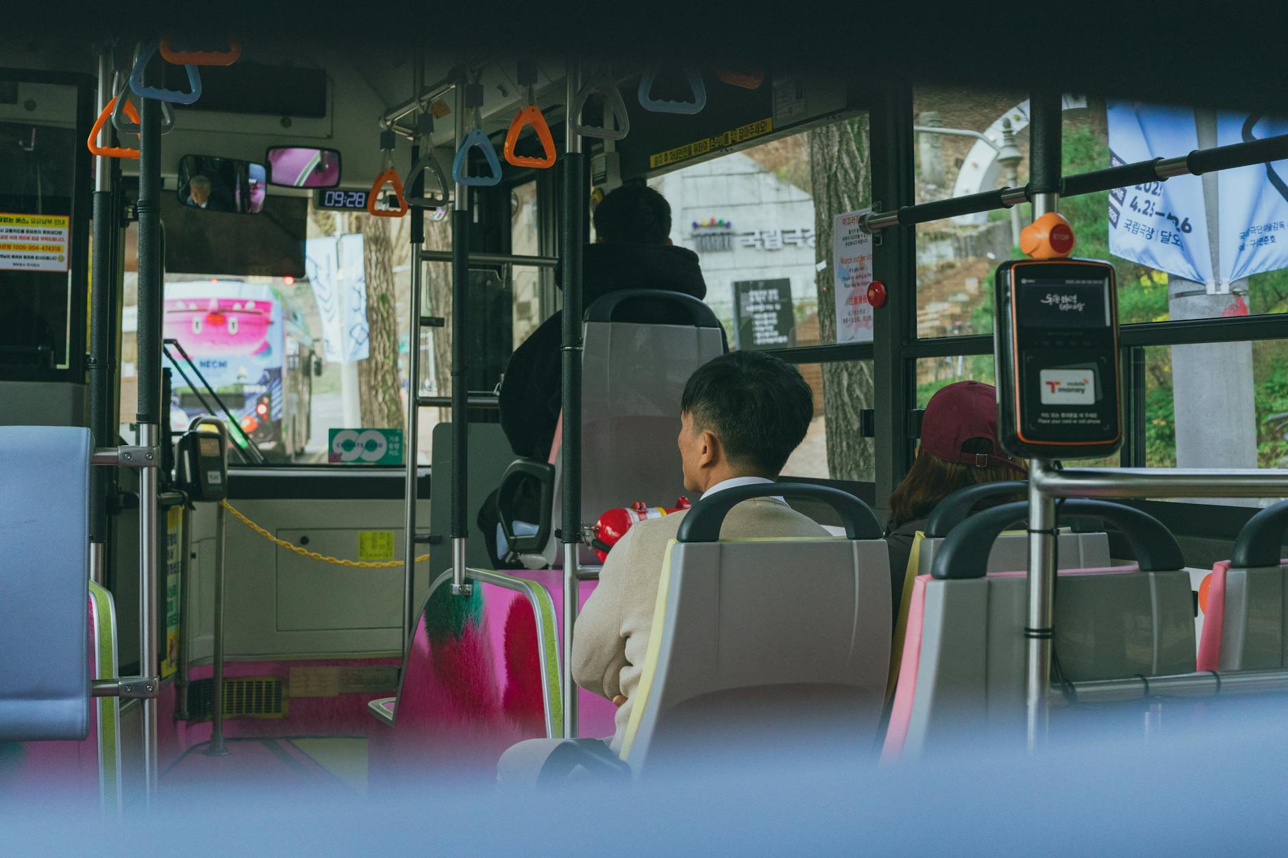 Public transportation hub in Seoul with buses and pedestrians