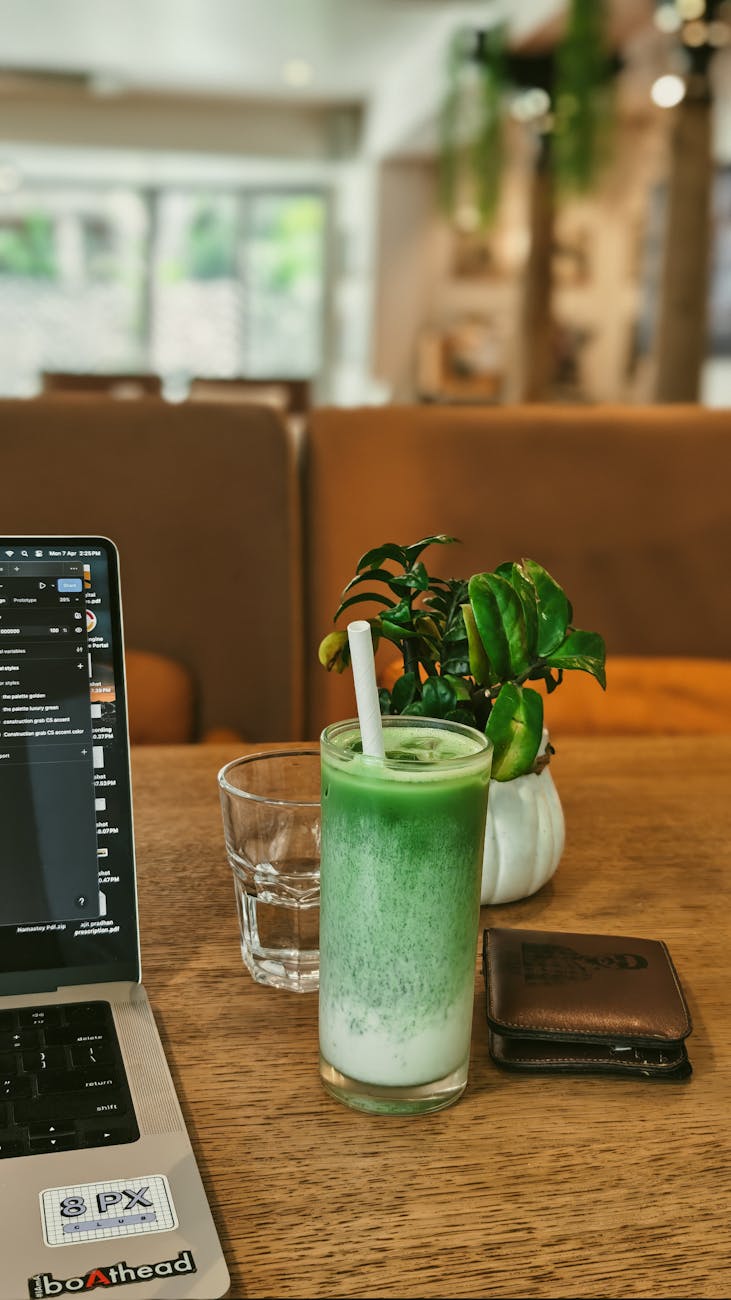 Digital nomad working on laptop in a Seoul cafe with city view