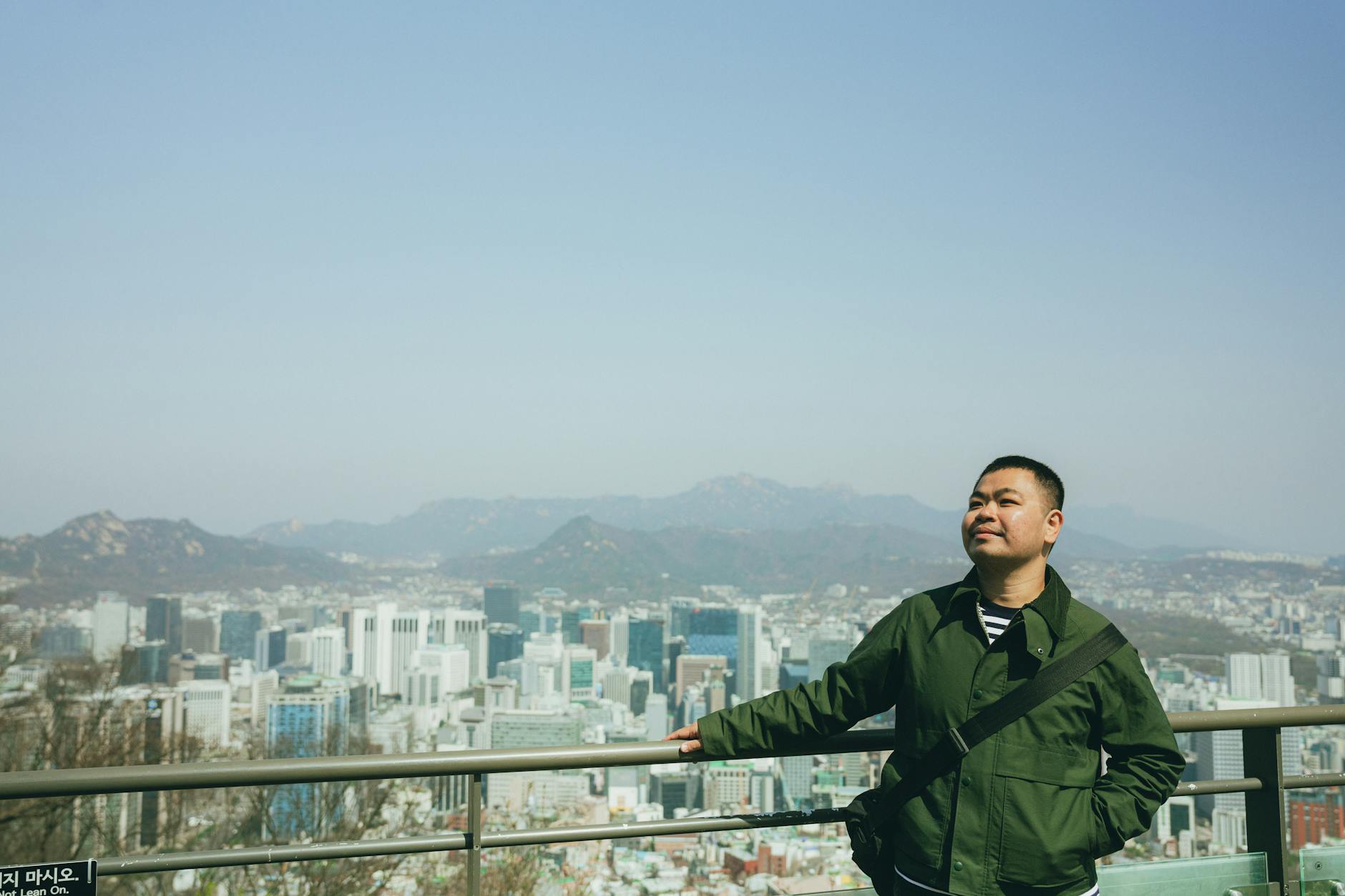 Seoul city skyline panorama with mountains and green nature