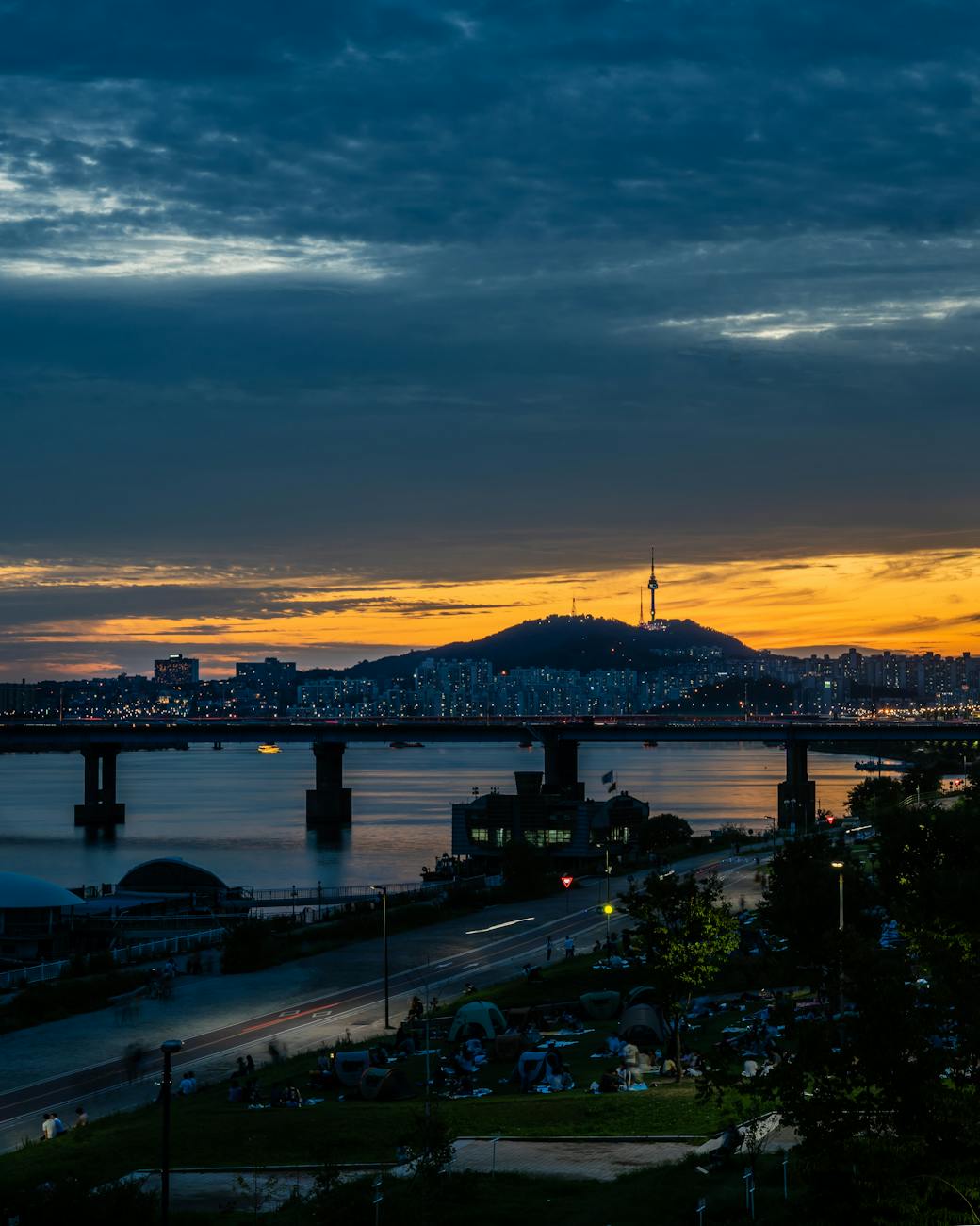 Seoul cityscape with Han River and bridges at sunset