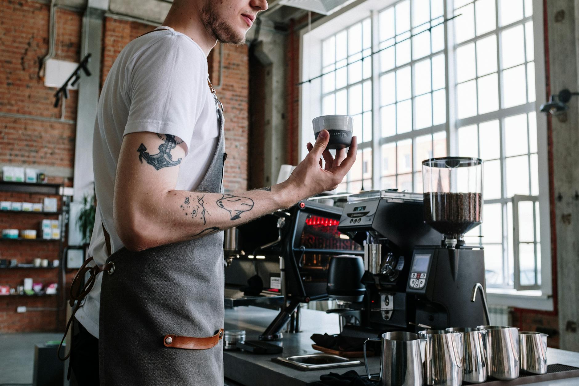 A skilled barista preparing specialty coffee at a Seoul cafe