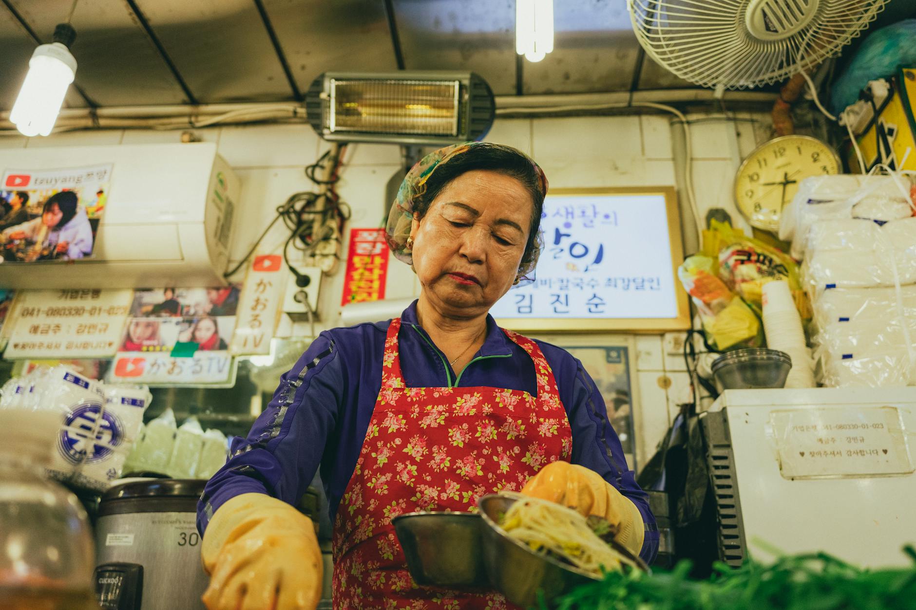 Bustling Seoul food market with vendors selling Korean street snacks