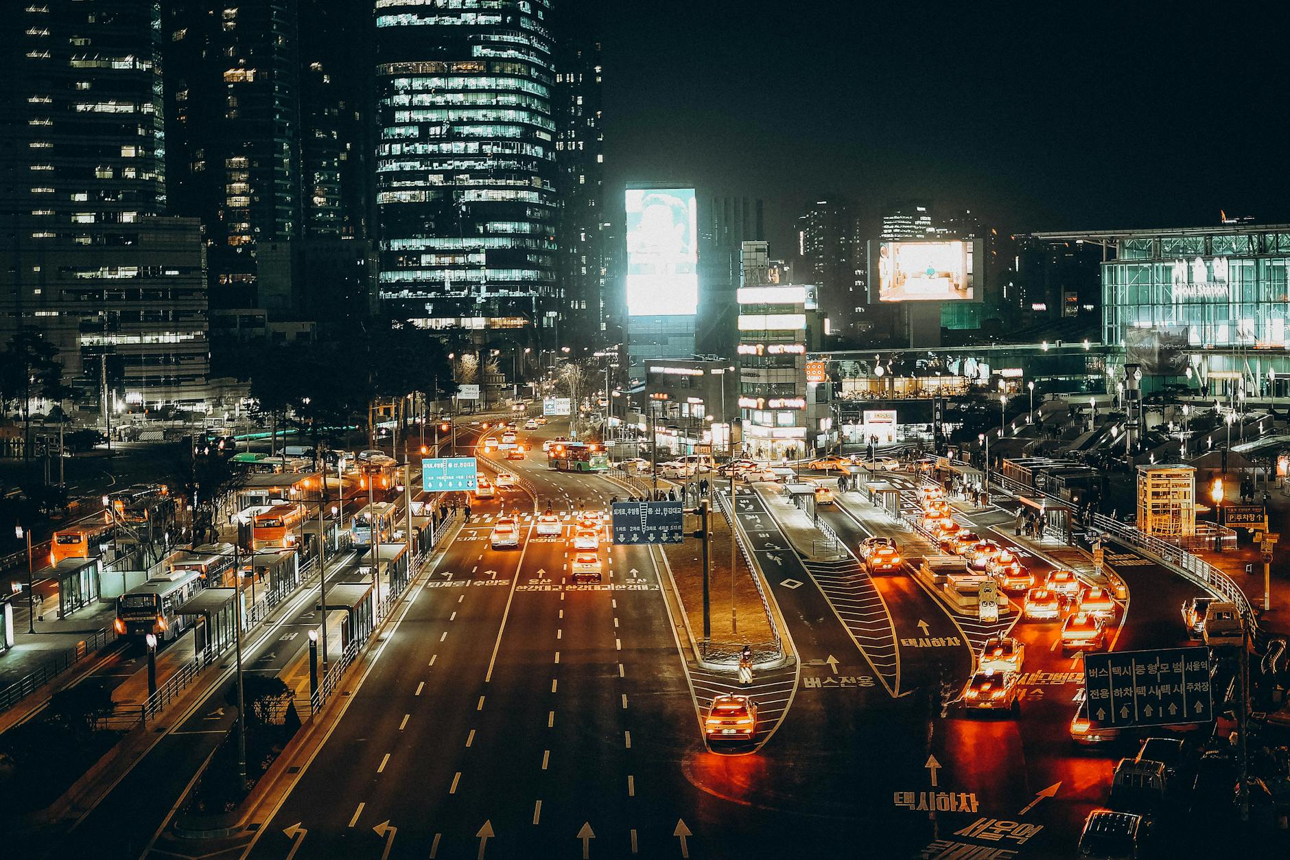 Seoul taxis at night with lit signs along Gangnam street
