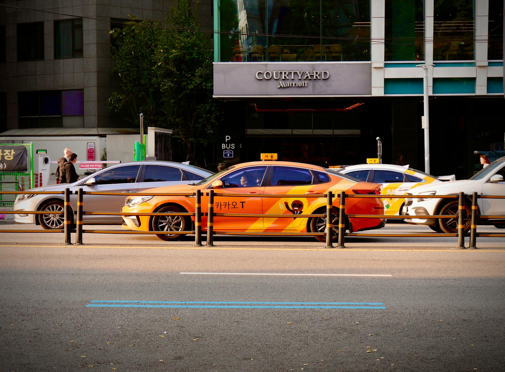 South Korea taxi driving past illuminated city lights