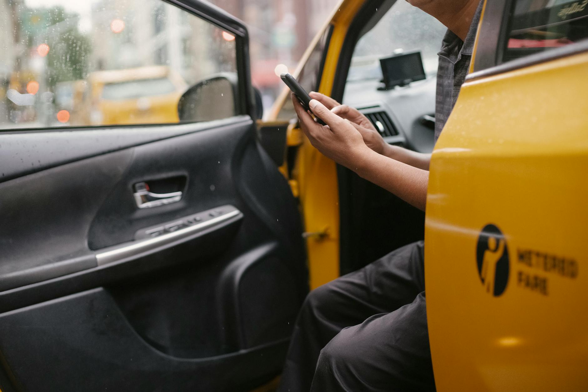 Smartphone showing a Korean ride-hailing app for booking a taxi