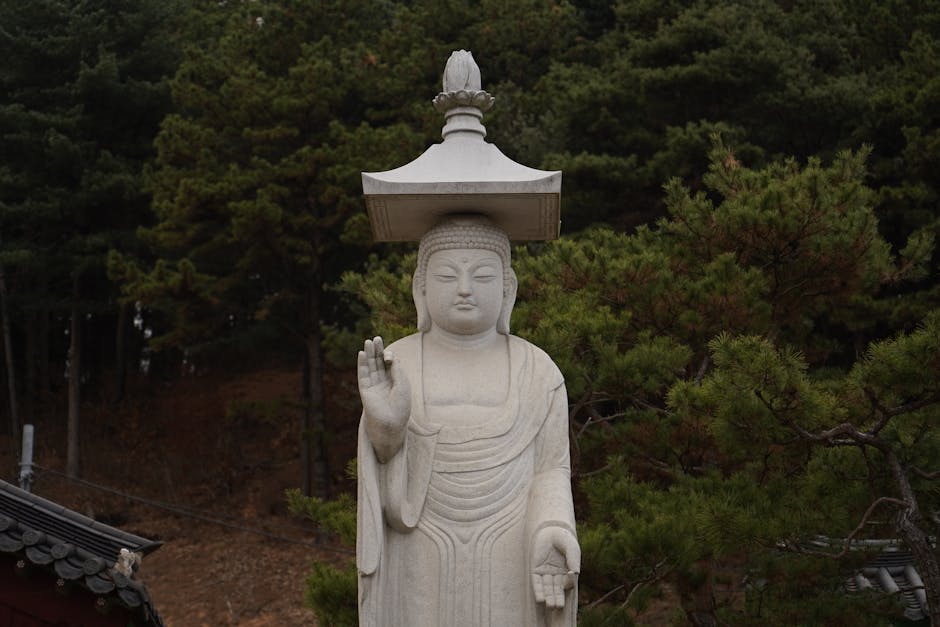 Elegant Buddha statue surrounded by lush greenery at a Seoul temple