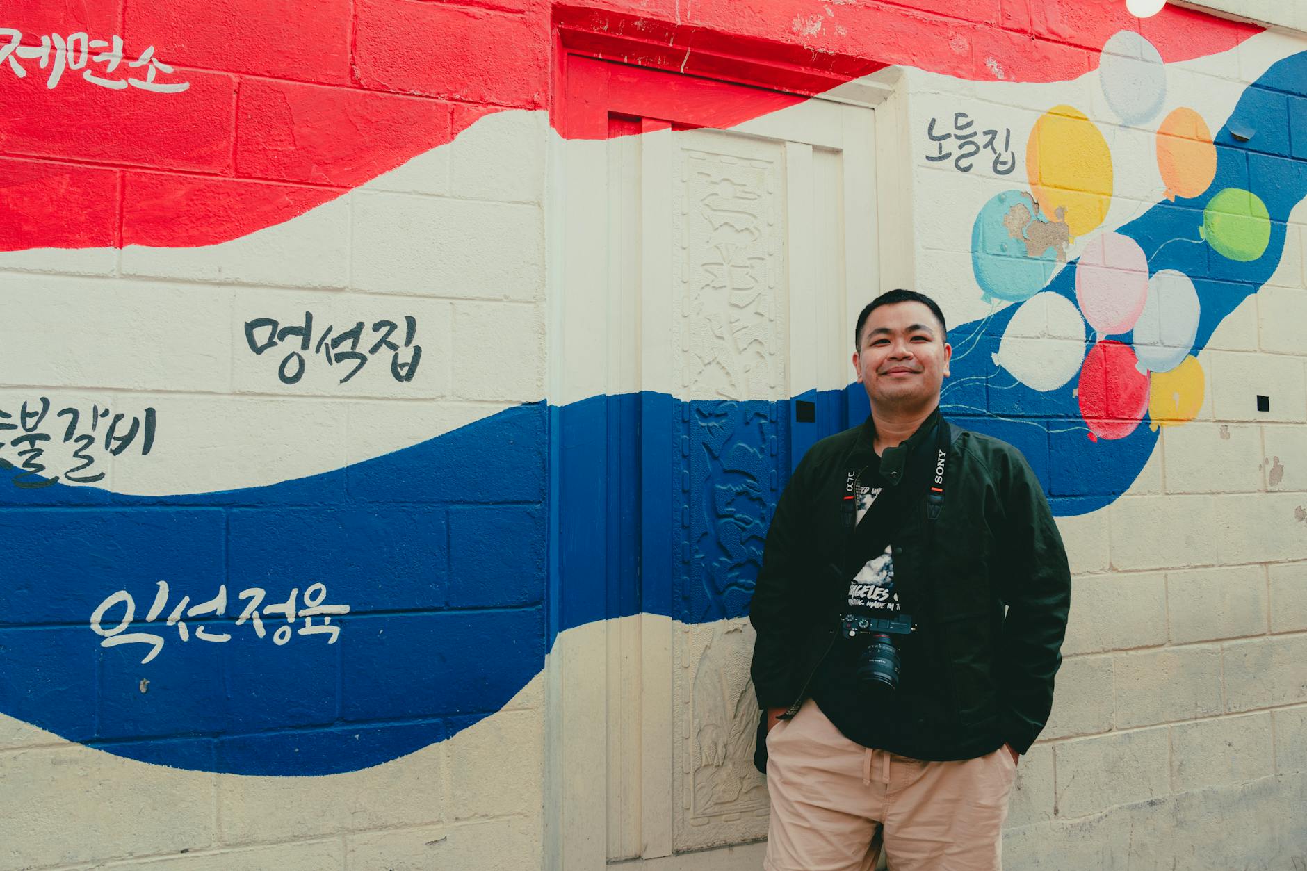 Colorful street art murals in Ihwa Village providing unique photo opportunities in Seoul