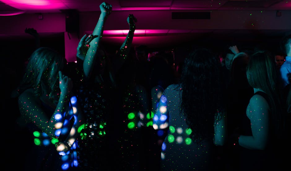 Energetic Seoul nightclub scene with people dancing under colorful neon lights