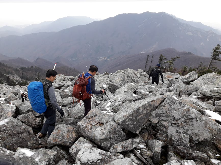 Hikers traverse rocky trail with mountain views in South Korea