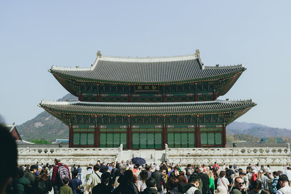 Gyeongbokgung Palace surrounded by tourists during springtime in Jongno