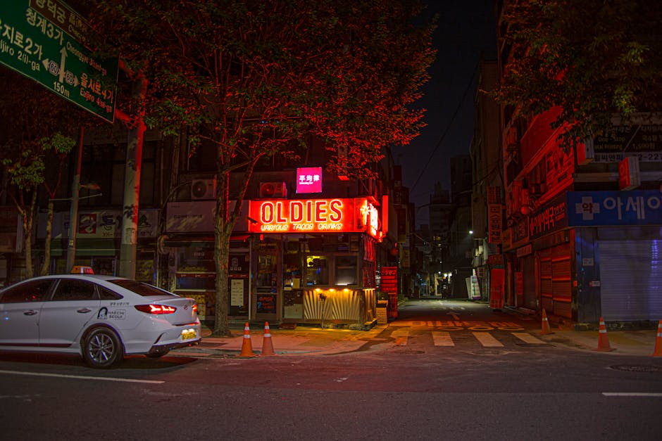 Vibrant street scene in Seoul illuminated by neon signs at night