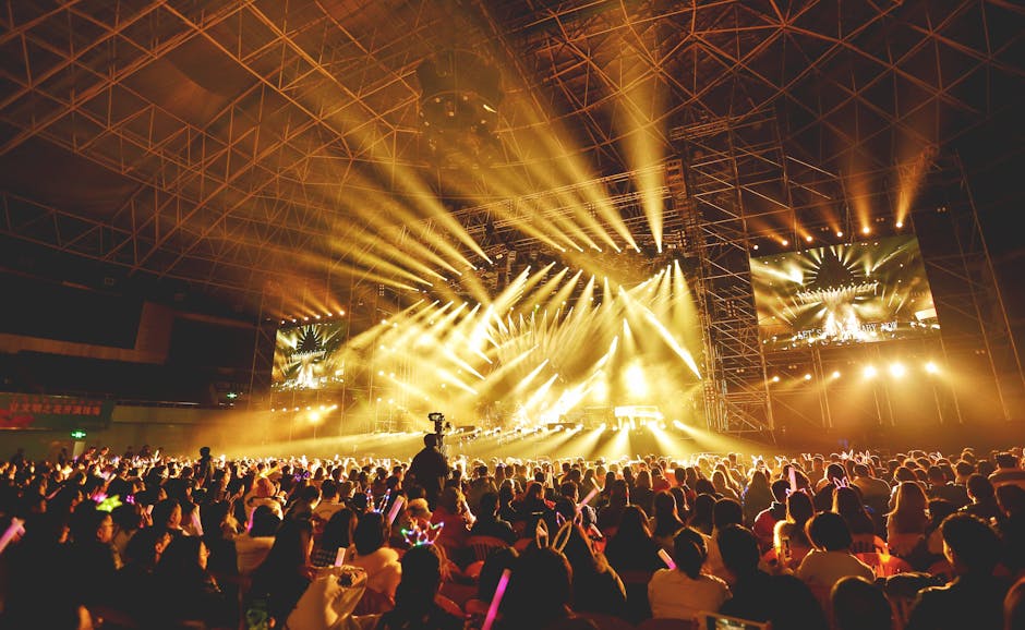 Dynamic K-pop concert scene with vibrant crowd and dazzling stage lights