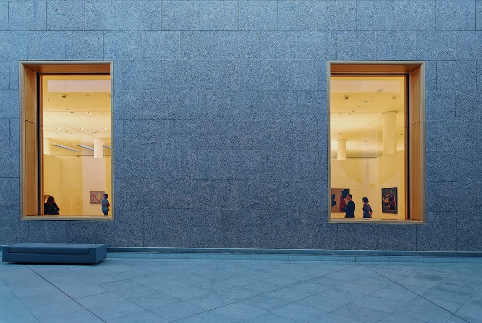 Modern art gallery exterior with large windows for rainy day Seoul activity