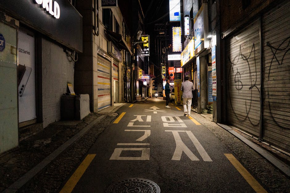 Nighttime urban scene in a narrow Yongsan Seoul street with vibrant city life