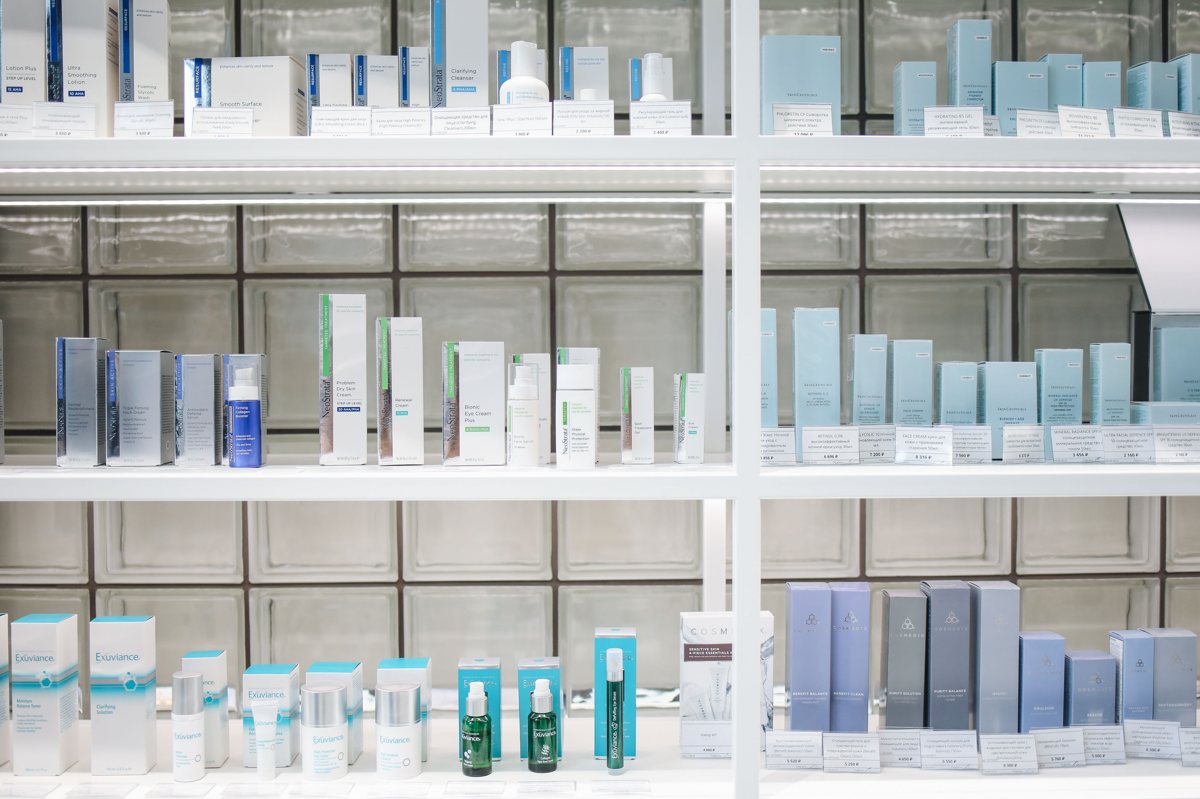 Rows of Korean skincare products on brightly lit Olive Young store shelves in Seoul