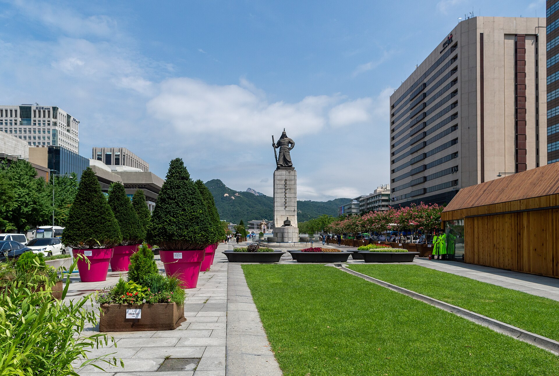 Gwanghwamun Square with the bronze statue of Admiral Yi Sun-sin, lawns and Bugaksan mountain behind