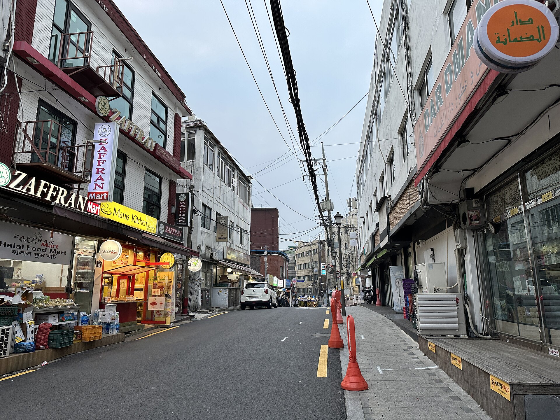 Street below Seoul Central Mosque lined with halal food shops and Arabic and Korean signage